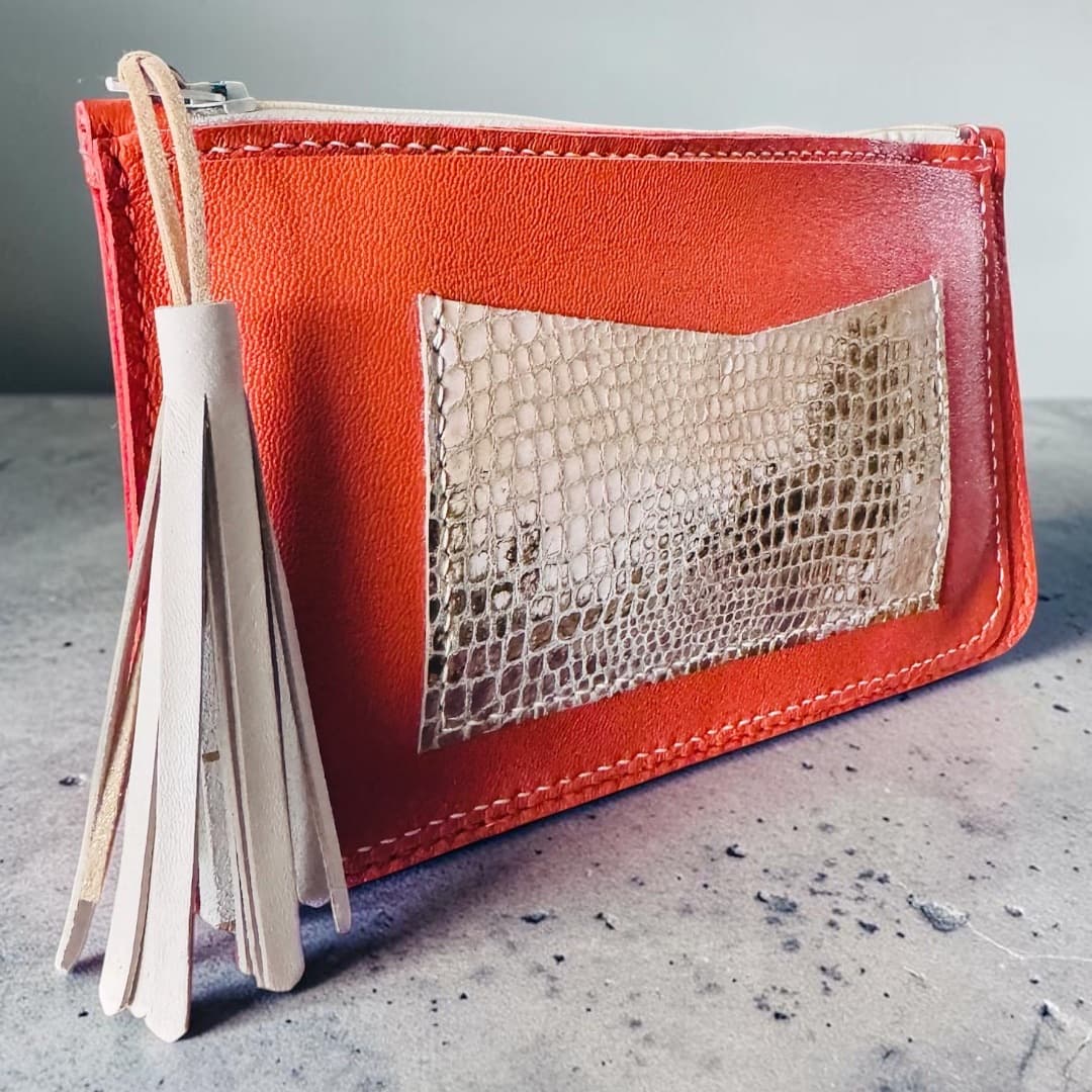 Pochette zippée en cuir orange