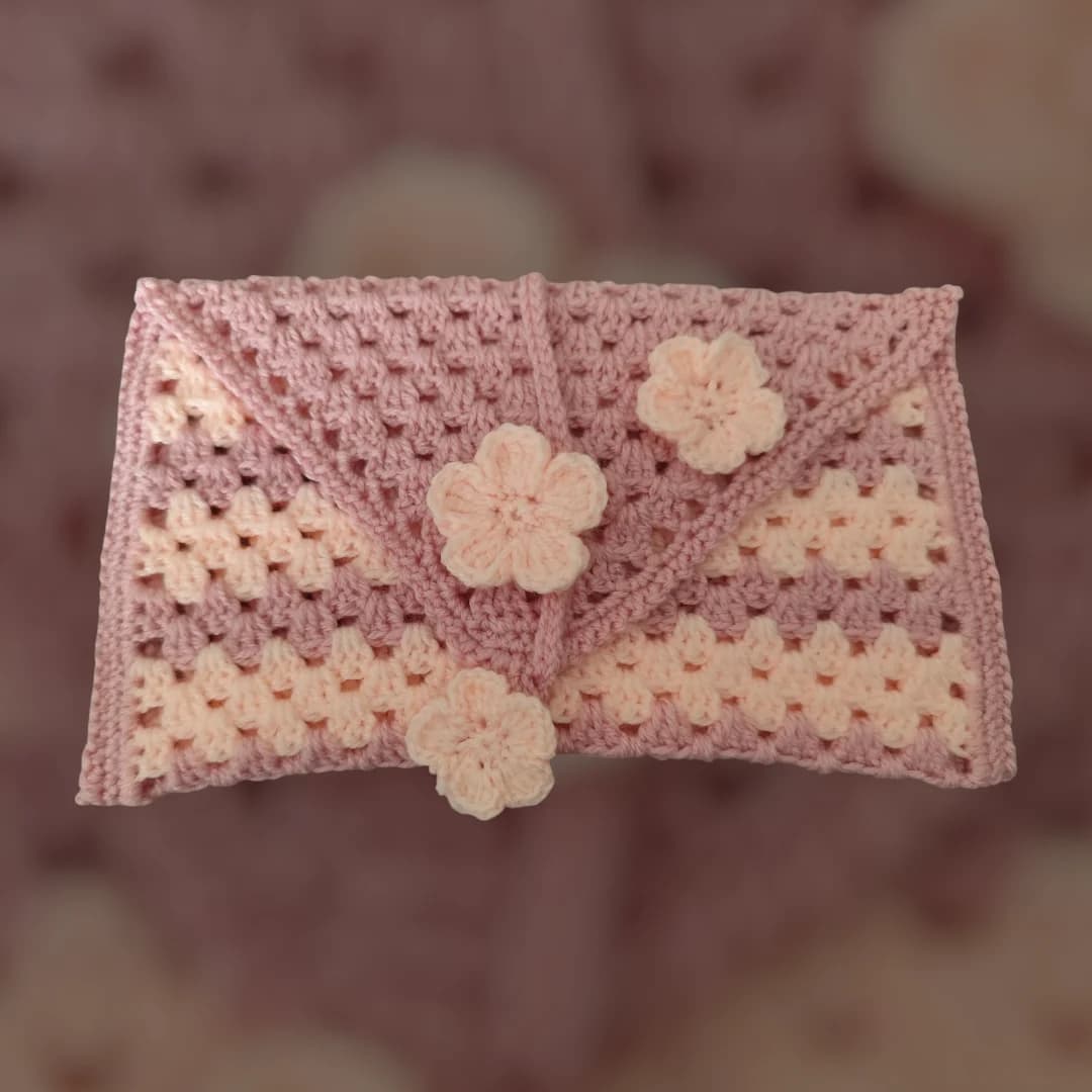 Étui pour livre au crochet rose poudré
