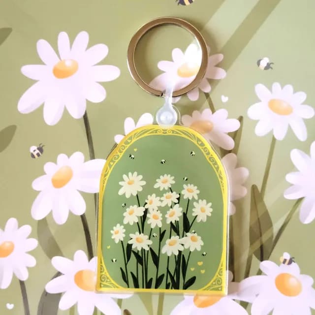 Porte-clés arqué en acrylique illustré de pâquerettes et d'abeilles sur fond vert