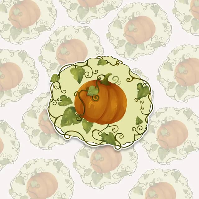 Sticker illustré d'une citrouille orange entourée de lianes et feuilles vertes sur fond découpé