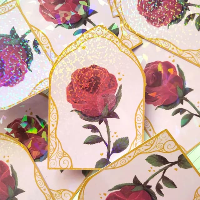 Vue rapprochée du sticker rose montrant les reflets irisés et l'encadrement ornemental