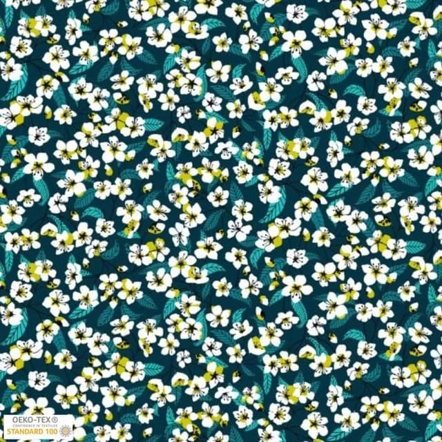 Motif textile fleuri de style Liberty avec petites fleurs blanches et feuilles sur fond bleu canard
